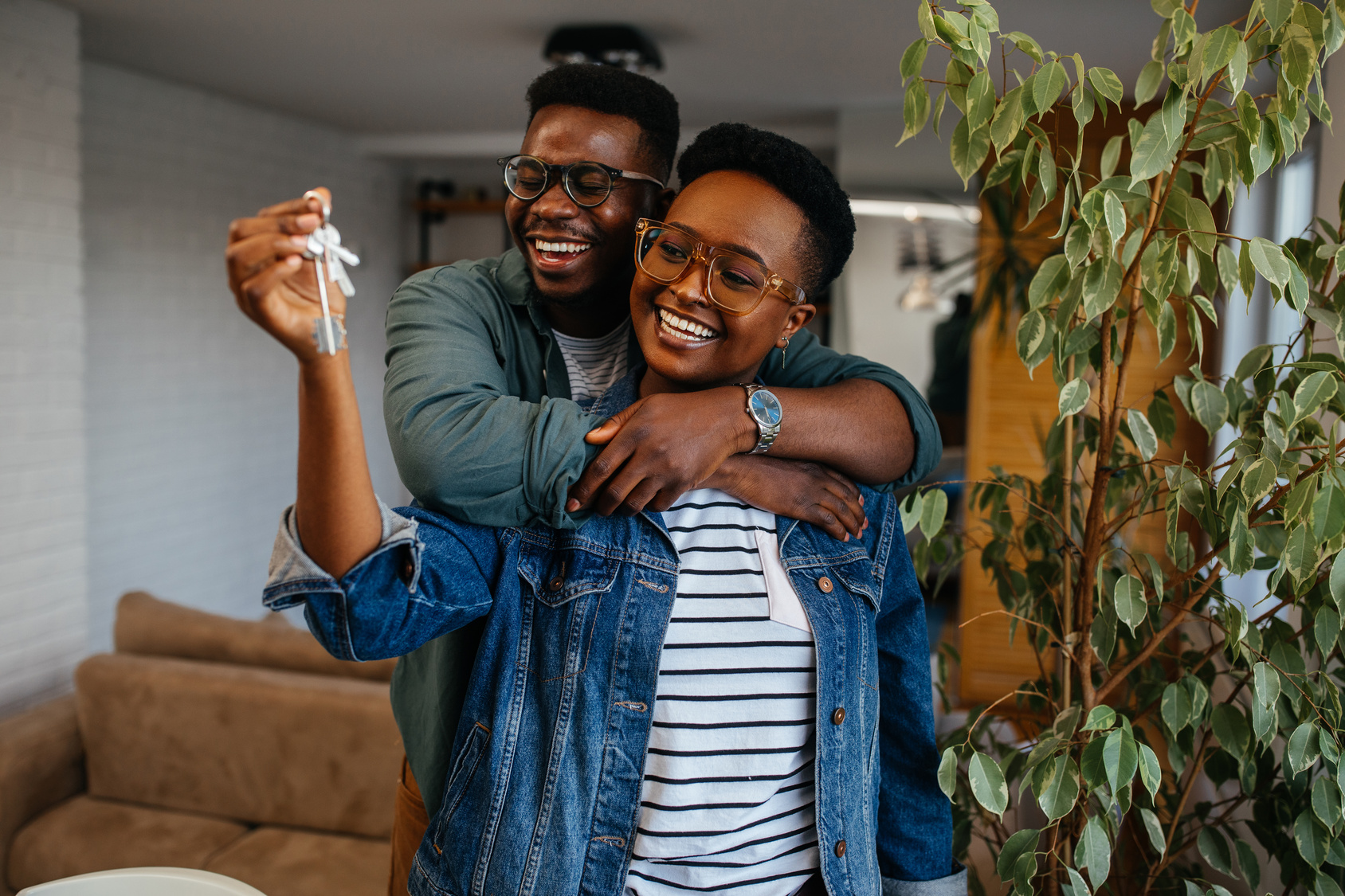 Couple holding the keys to their new home